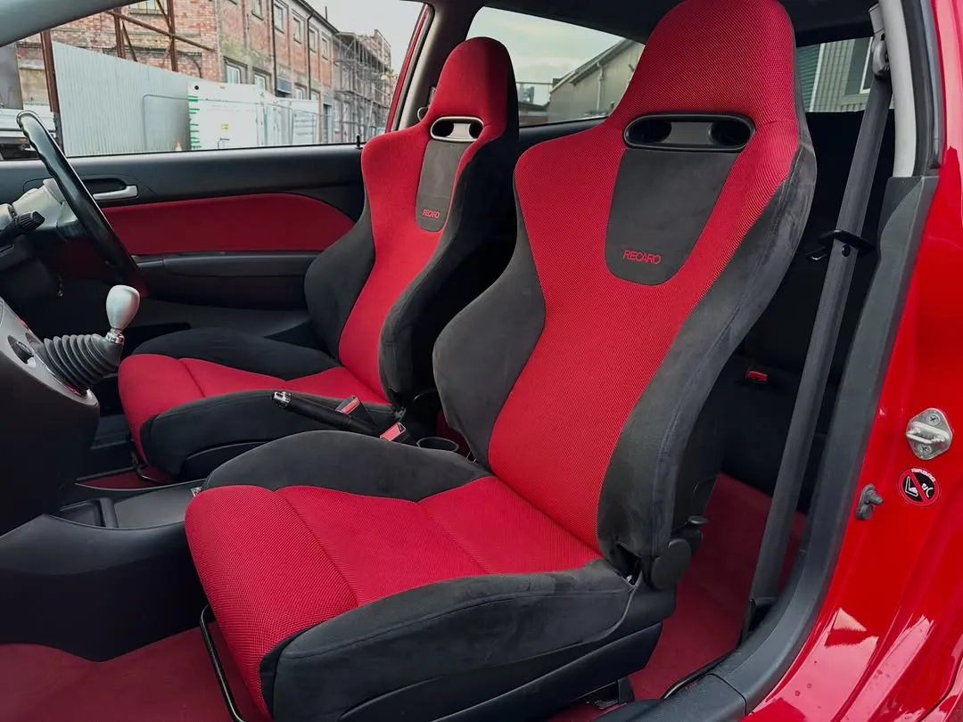 2005 Honda Civic Type R (EP3) Premier Edition: Recaro seats and red carpet through the open door